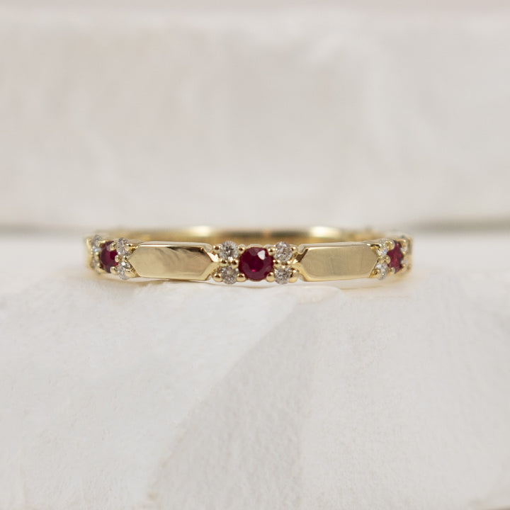 10KY Elongated Hexagon Bar Ruby & Diamond Band
10K Yellow Gold Ruby & Diamond Band 
0.13 Total Diamond Weight I2 Clarity, H-J Colour 
Finger Size 6.75