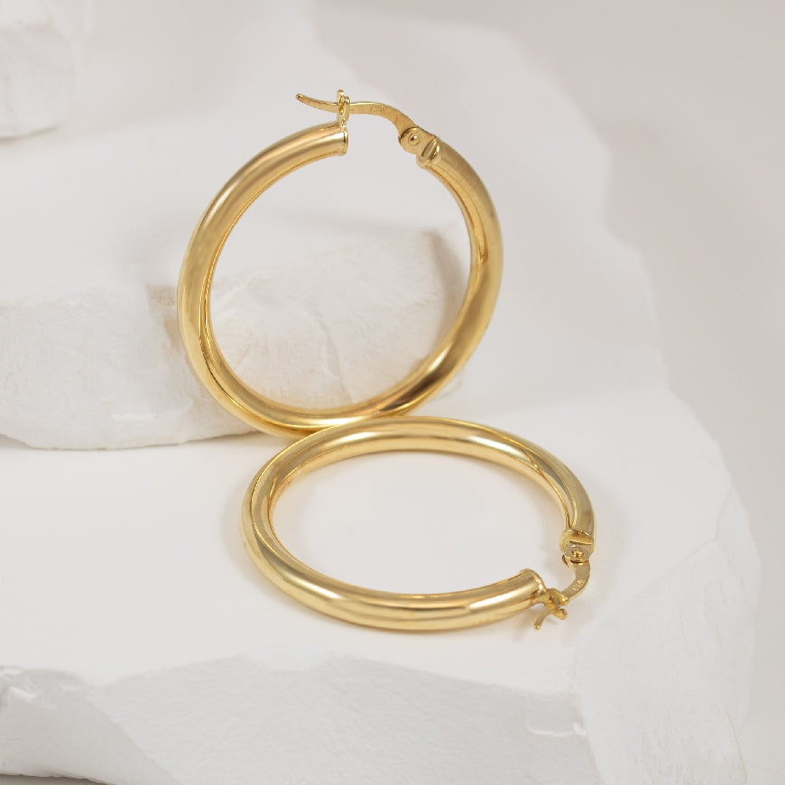 10KY Tube Huggie Hoop Earrings
10K Yellow Gold Tube Hoop Earrings
Earring Closure Hinged Post
25mm Diameter
2.29 Grams