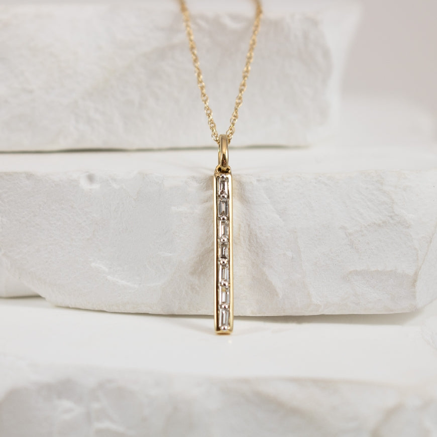 14KY Diamond Baguette Bar Necklace
14K Yellow Gold Natural Diamond Baguette Bar Necklace
0.08 Total Natural Baguette Cut Diamond Weight SI Clarity, GH Colour
Chain Length 18'