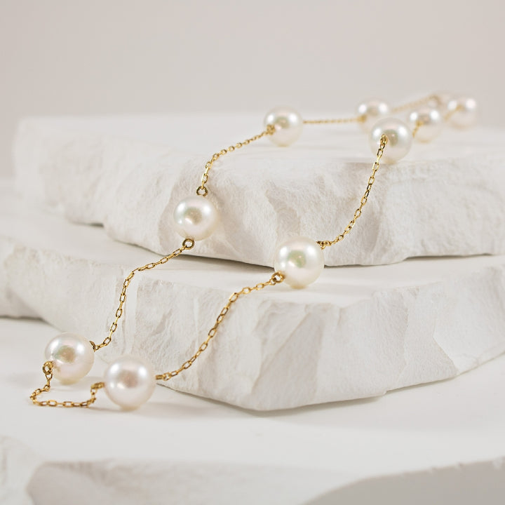 14KY Akoya Pearl Station Necklace         
14K Yellow Gold Akoya Pearl 11 Station Necklace 
7-7.5mm Akoya Pearls 
Chain Length 17' Adjustable