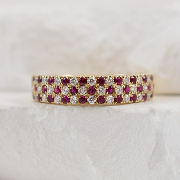 14KY Ruby & Diamond Checkered Pattern Ring                      
14K Yellow Gold Ruby & Diamond Ring 
0.39 Carats of Rubies 
0.36 Carat Total Diamond Weight of SI1-2 Clarity, GH Colour 
4.5mm Wide 
Finger Size 6.5