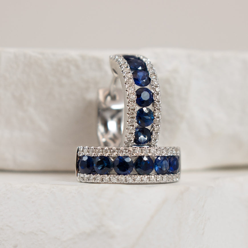 14KW S.Kashi Sapphire & Diamond Hoop Earrings        
14K White Gold S.Kashi Natural Diamond & Sapphire Hoop Earrings 
0.16 Carat Total Diamond Weight of SI1-2 Clarity, G-H Colour
0.88 Carat Total Sapphire Weight
