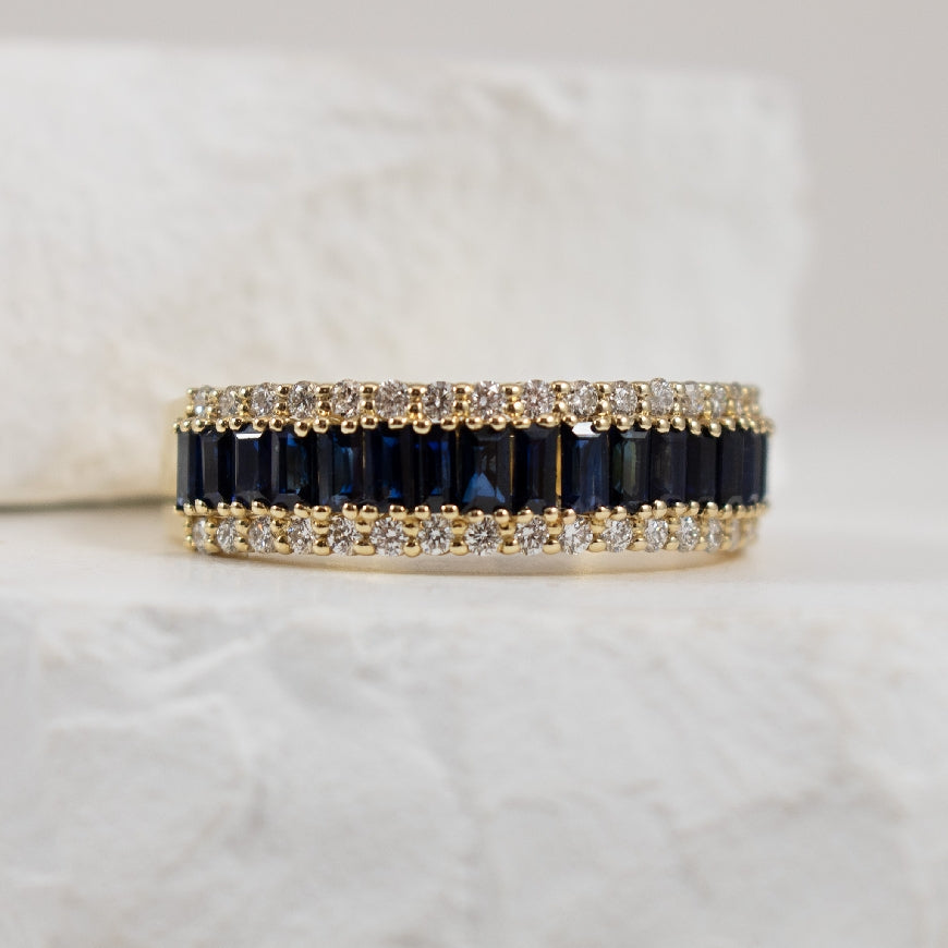14KY S.Kashi Baguette Sapphire & Diamond Ring            
14K Yellow Gold S.Kashi Natural Diamond & Baguette Sapphire Ring
0.45 Carat Total Diamond Weight of SI1-2 Clarity, G-H Colour
1.05 Carat Total Sapphire Weight