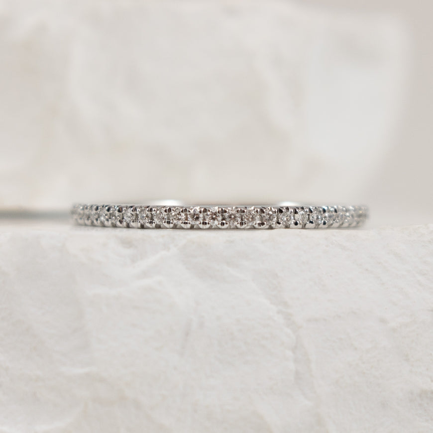 10KW 0.10CT Straight Diamond Band                 
10K White Gold Natural Diamond Band
0.10 Total Natural Diamond Weight I1 Clarity, GHI Colour
Finger Size
