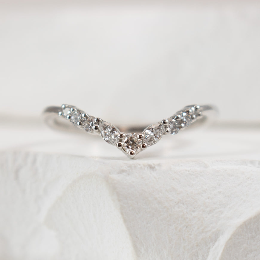 14KW Marquise & Round Cut Diamond Chevron Band    
14K White Gold Natural Diamond Chevron Contour Band 
0.20 Carats Round Brilliant & Marquis Cut Diamonds of SI2-SI3 Clarity, G-H Colour 
Finger Size 7