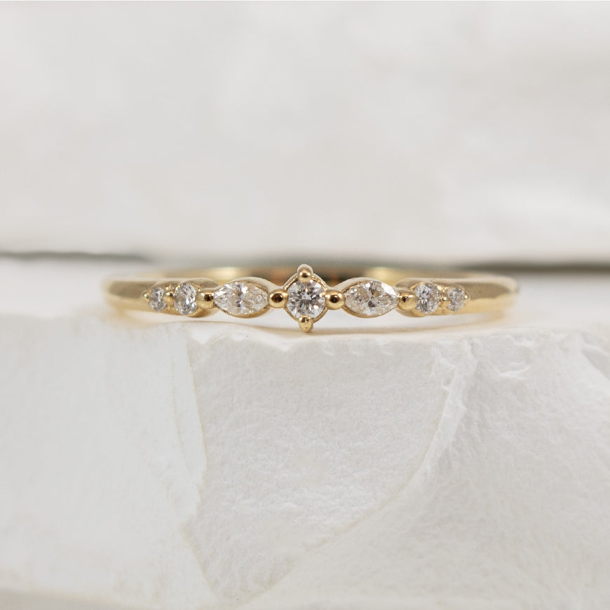 14KY 0.12CT Marquise & Round Cut Diamond Band     
14K Yellow Gold Natural Diamond Band 
0.12 Total Round Brilliant & Marquise Cut Natural Diamond Weight SI1-2 Clarity, G-H Colour 
 
Finger Size 6.75