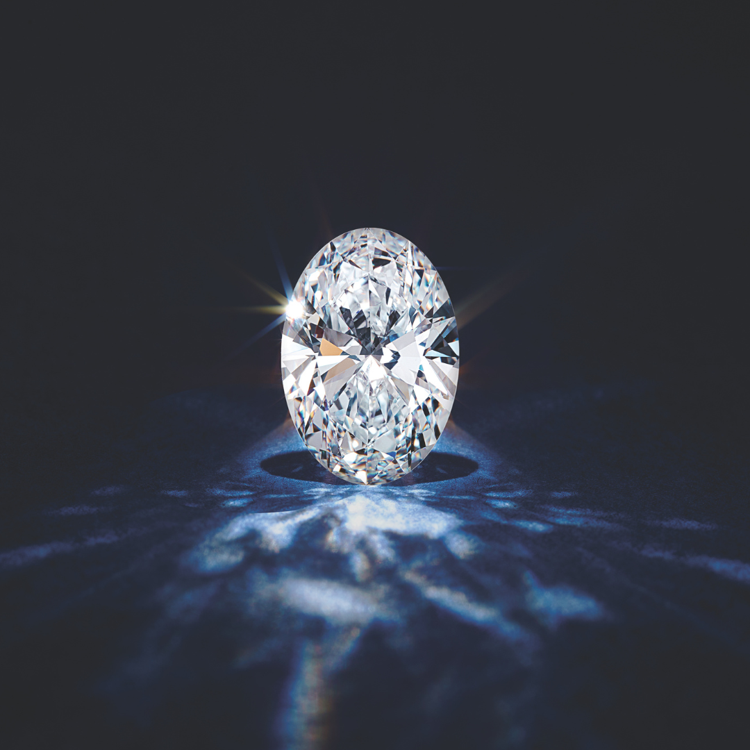 sparkling oval diamond against a dark background