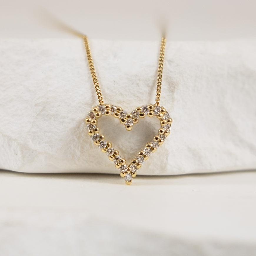 10KY Diamond Heart Necklace

10K Yellow Gold Natural Diamond Heart Necklace

0.125 Carat Round Brilliant Cut Natural Diamonds of I1  Clarity, JKL Colour

Chain Length 18'
