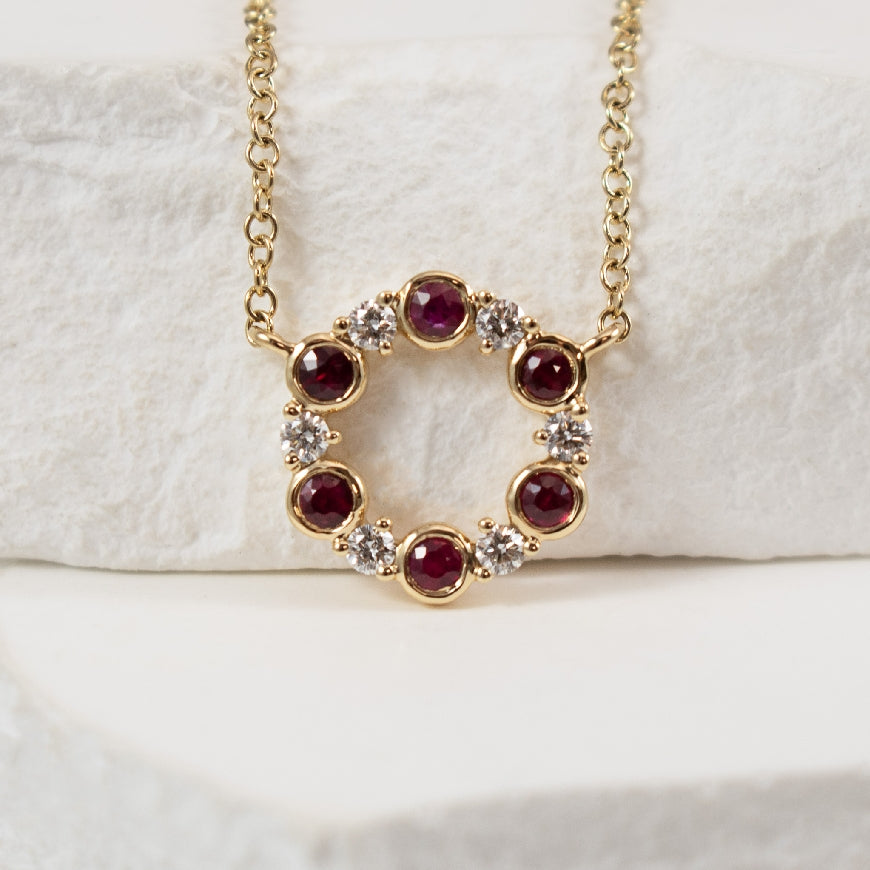 14KY Ruby & Diamond Alternating Circle Necklace

14K Yellow Gold Natural Diamond & Ruby Alternating Bezel-Set Circle Necklace

0.19 Carats Total Ruby Weight

0.10 Total Diamond Weight SI Clarity, GH Colour 

18' Chain Lenght (Adjustable to 17