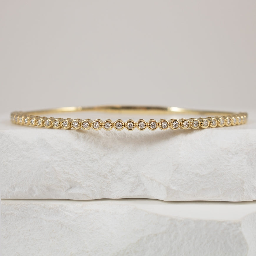 14KY Diamond Bezel Style Flex Bangle 

14 Karat Yellow Gold Natural Diamond Bezel Style Flexiable Bangle Bracelet 

0.56 Carats Total Natural Diamond Weight of SI2-I1 Clarity, HI Colour 

6.75' Bracelet Length 



