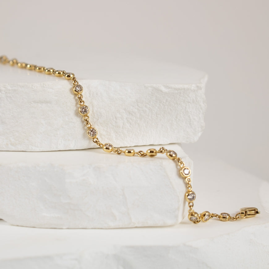 14K Yellow Gold Round Diamond Bezel Set Station Bracelet