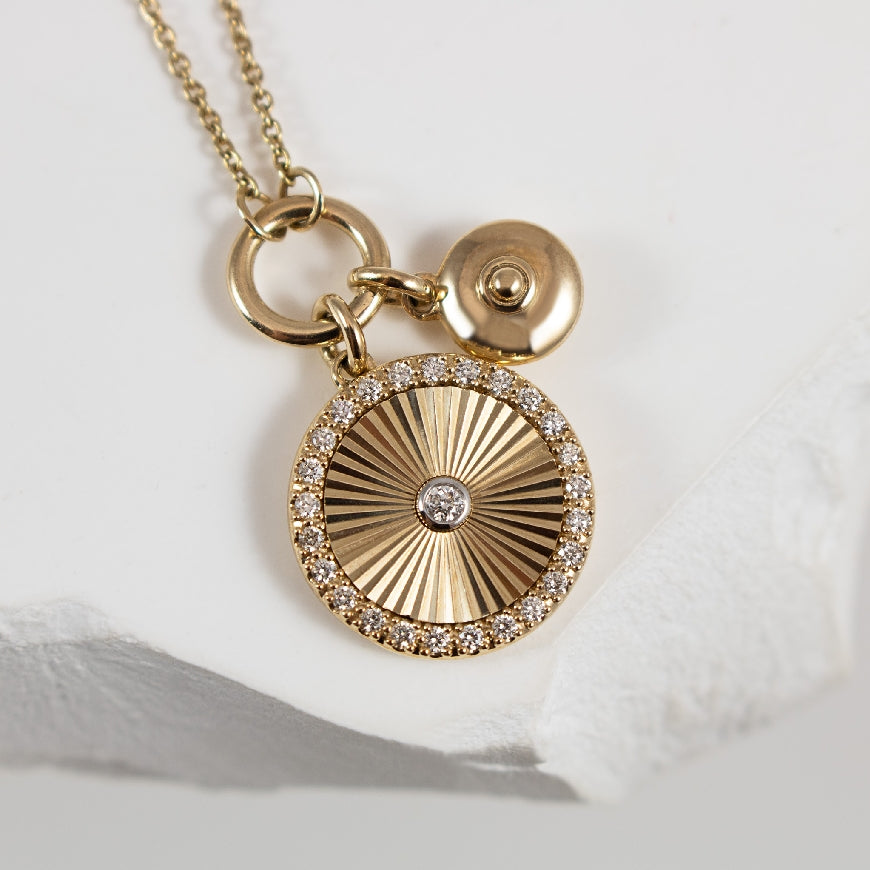 10KY Disc Charm Necklace

10K Yellow Gold Double Disc Diamond Charm Necklace

0.15 Total Natural Diamond Weight of SI2-I1 Clarity, IJ Colour

Chain Length 18' (Adjustable to 17' & 16')

