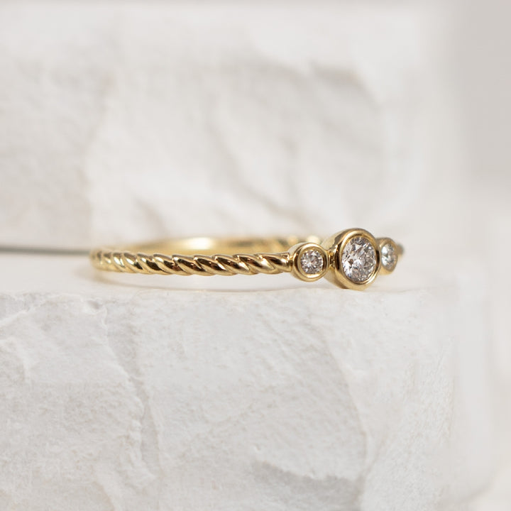 10KY Petite Three Stone Bezel Set Twist Ring