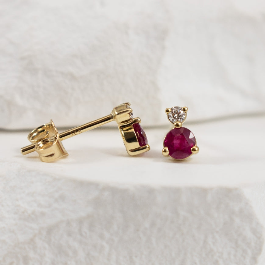 14KY Petite Ruby & Diamond Earrings    

14K Yellow Gold Ruby & Natural Diamond Petite Stud Earrings 

3.50mm Round Rubies

0.05 Total Natural Diamond Weight of SI2-I1 Clarity, IJ Colour

Earring Closure Posts w. Butterfly Backs 


