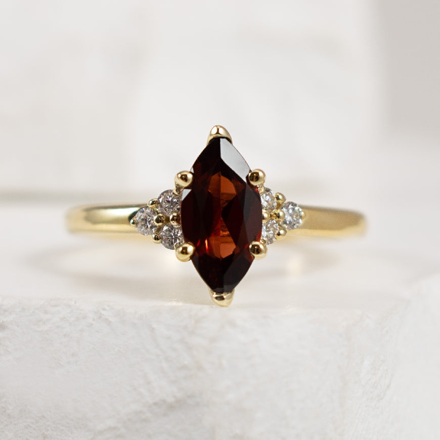 10KY Garnet & Canadian Diamond Marquise Ring

10 Karat Yellow Gold Marquise Cut Garnet & Canadian Maple Leaf Diamond Ring  

10x5mm Marquise Cut Garnet 

0.13 Carat Total Natural Diamond Weight of SI2 Clarity, H Colour

Finger Size 6.5