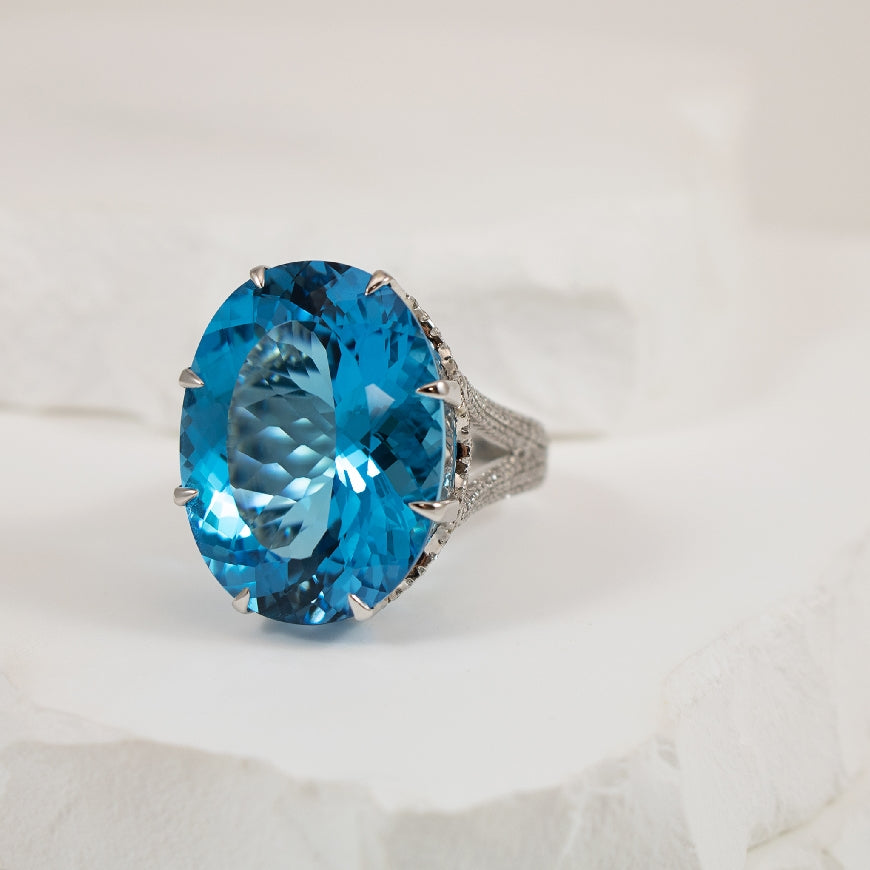 18KW 34.31CT Oval Cut Blue Topaz & Diamond Ring    

18K White Gold Blue Topaz & Diamond Ring

34.31 Carat of Natural Oval Cut Blue Topaz 
1.72 Total Natural Diamond Weight SI1 Clarity, GH Colour

Finger Size 7.5

