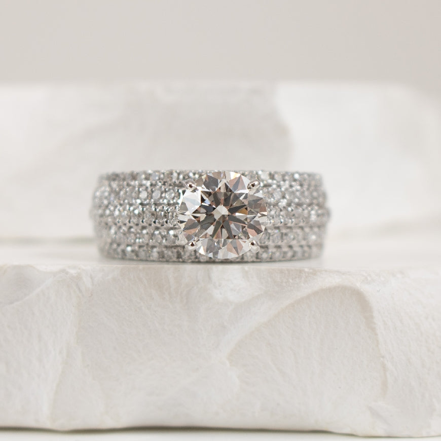14KW 1.50 Carat Wide Diamond Engagement Ring          

14K White Gold Lab Grown & Natural Wide Diamond Engagement Ring 

Center - 1.50 Carat Round Birlliant Cut Lab Grown Diamond of VVS2 Clarity, F Colour, Ideal/ Excellent/ Excellent Cut, IGI Ce