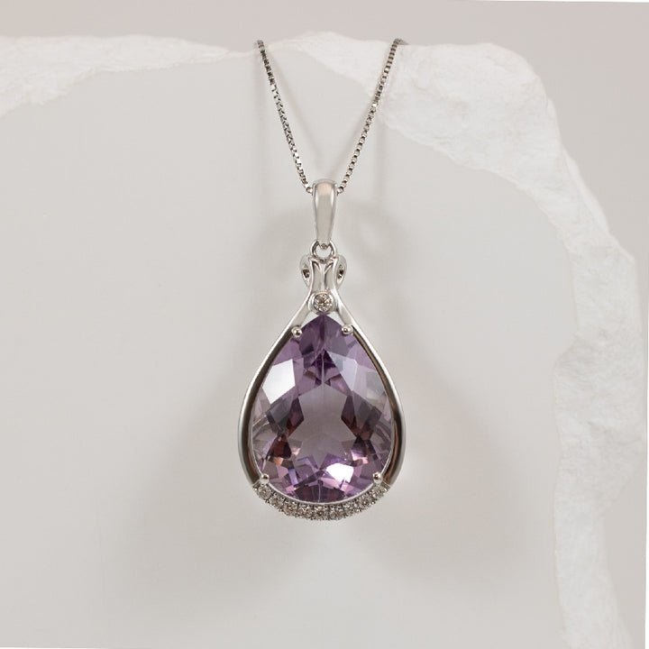 14KW Pear Shape 7.54CT Amethyst & Diamond Necklace

14K White Gold Amethyst & Natural Diamond Necklace

7.54 Carat of Natural Pear Shaped Amethyst
0.08 Total Natural Diamond Weight

Chain Length 18'

