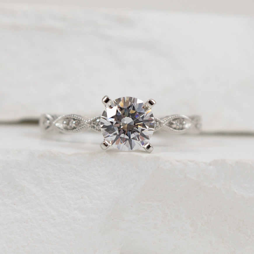 14KW Vintage Diamond Milgrain & Engraved Ring Setting

14K White Gold Gabriel & Co. Vintage Diamond Accented Milgrain & Engraved Ring Setting

Center - To Hold 1.00 Carat Round Brilliant Cut Diamond

Accent - 0.12 Carats Natural Diamonds SI2+ C
