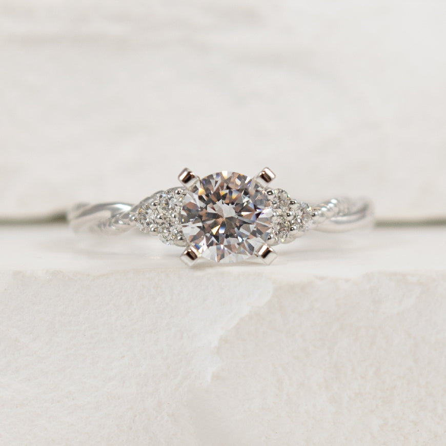 14KW Gabriel & Co. Double Twist Engagement Ring 

14K White Gold Gabriel & Co. Natural Diamond Double Twist Engagement Ring 

Center - 0.73 Carat Round Brilliant Cut Natural Diamond of I1-2 Clarity, HI Colour 

Accent - 0.12 Carats Natural Diam