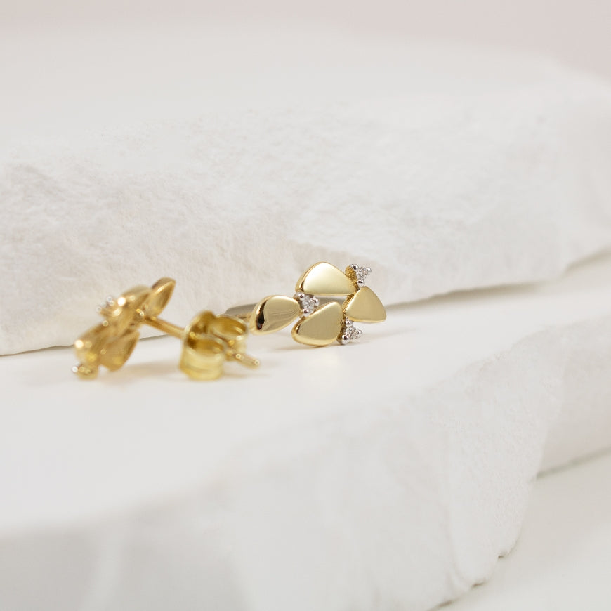14KY Modern Pebble Diamond Accented Earrings        

14K Yellow Gold Natural Diamond Earrings

0.03 Total Natural Diamond Weight 

Earring Closure Post with Butterfly Back
