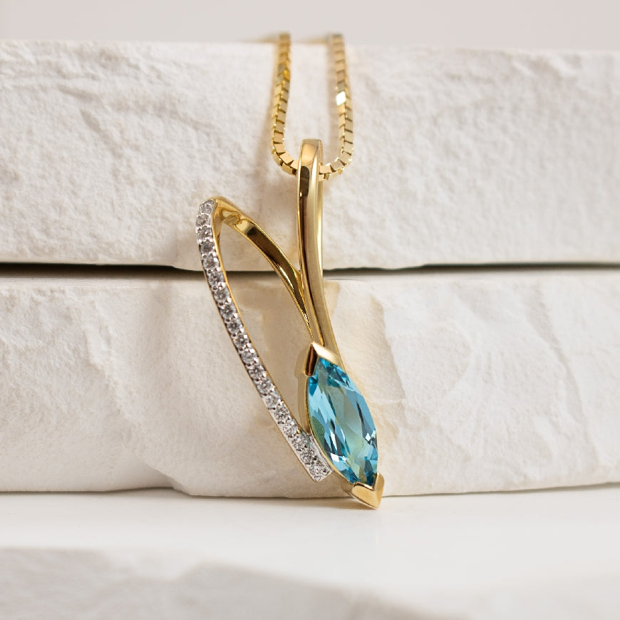 14KY Gold Breuning Blue Topaz & Diamond Necklace  

14K Yellow & White Gold Breuning Blue Topaz & Diamond Necklace 

0.10 Total Natural Diamond Weight 

Chain Length 18'

