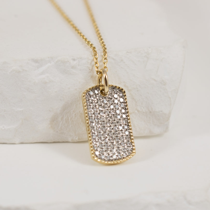 14KY Pave Diamond Mini Dog Tag Necklace             

14K Yellow Gold Natural Diamond Mini Dog Tag Necklace 

0.22 Total Natural Diamond Weight of SI Clarity, GH Colour 

Chain Length 18'


