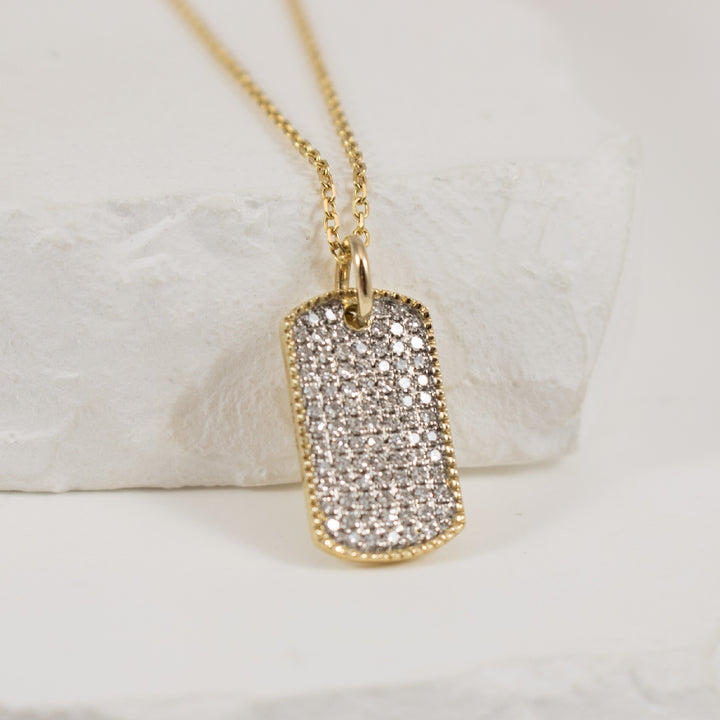 14KY Pave Diamond Mini Dog Tag Necklace             

14K Yellow Gold Natural Diamond Mini Dog Tag Necklace 

0.22 Total Natural Diamond Weight of SI Clarity, GH Colour 

Chain Length 18'


