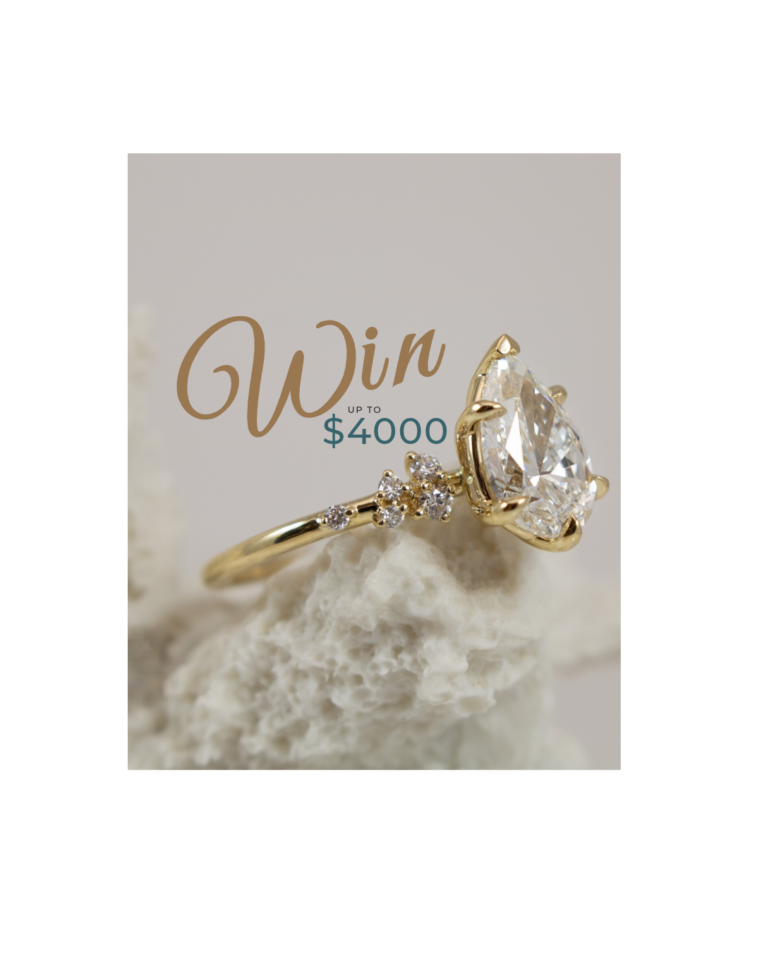 Win up to $4000 overlayed on an image of a 14K yellow gold pear shaped diamond engagement ring on a delicate celestial diamond band. 