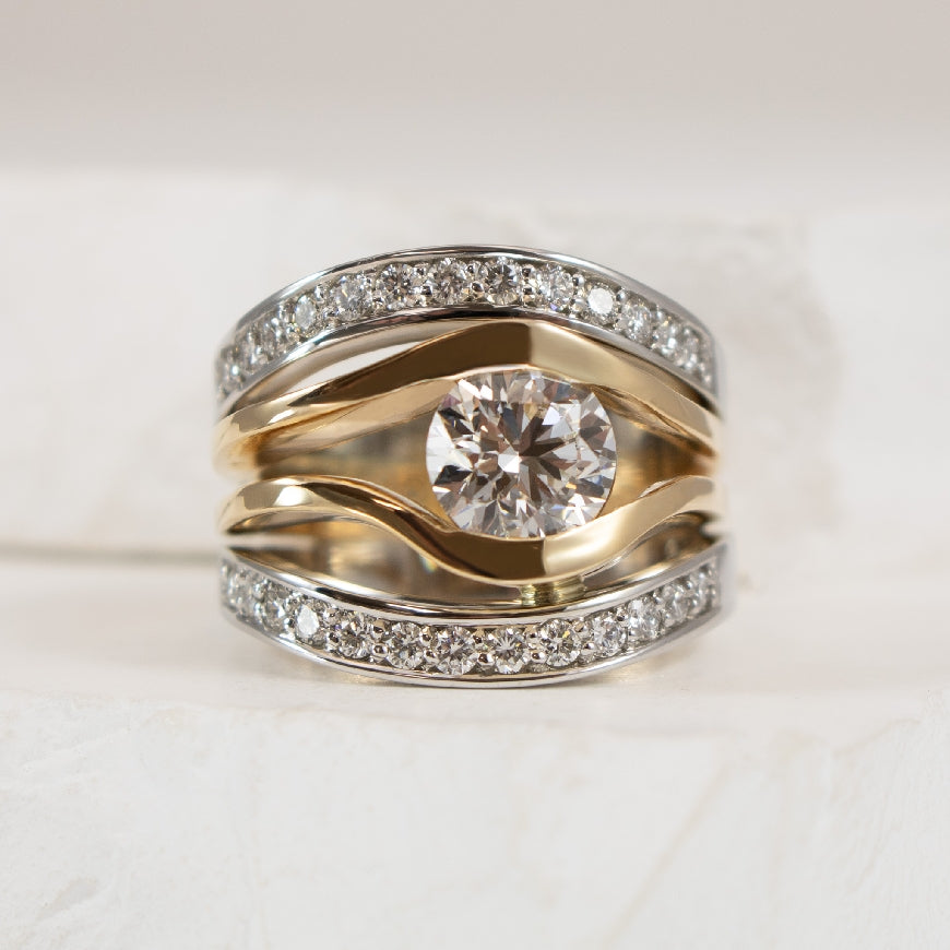 14KY/W 1.40CT Round Brilliant Cut Diamond Ring    

14K Yellow & White Gold Lab Grown & Natural Diamond Ring 

Center - 1.40 Carat Round Brilliant Cut Lab Grown Diamond of VVS2 Clarity, E Colour, Excellent/ Excellent/ Excellent Cut, IGI Certified