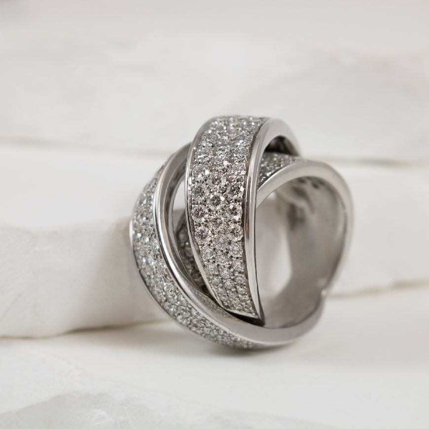 18KW Wrapped Pave Diamond Bold Ring            

18K White Gold Pave Natural Diamond Ring

4.90 Total Natural Round Brilliant Cut Diamond Weight SI1 Clarity, G Colour

Finger Size 7

