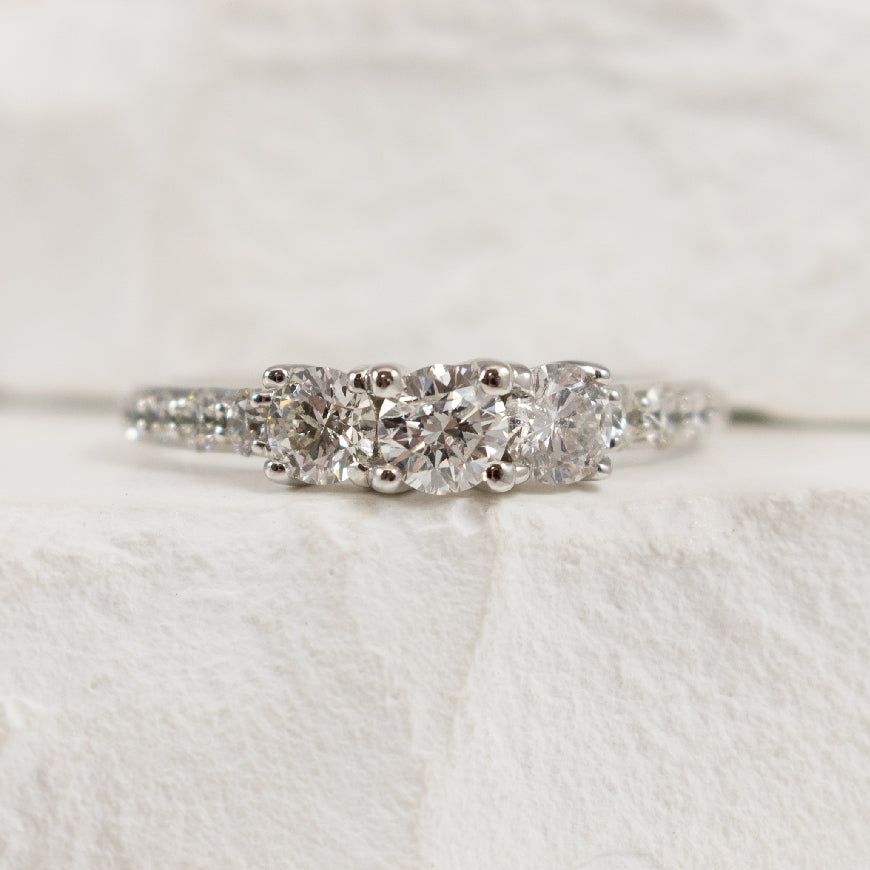 14KW Diamond Three Stone Accented Ring            

14K White Gold Natural Diamond Three Stone Accented Ring

0.32 Carat Round Brilliant Cut Natural Diamond of I1-2 Clarity, IJK Colour
1.00 Total Natural Diamond Weight

Finger Size 6.75



