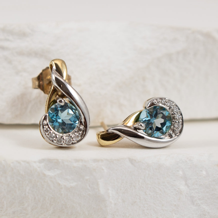 10K Two Tone Blue Topaz & Diamond Earrings        

10K Yellow & White Gold Blue Topaz & Diamond Earrings

0.05 Total Natural Diamond Weight 

Earring Closure Post with Butterfly Back 

