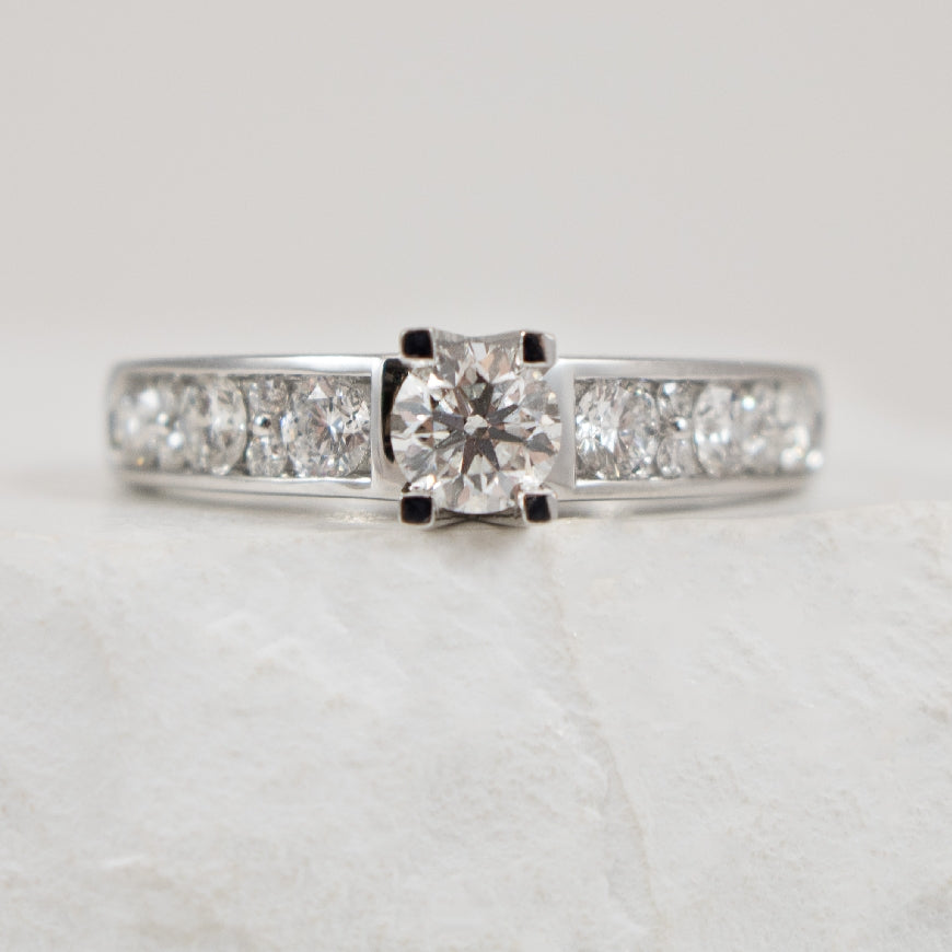 14K White Gold Diamond Accented Ring 

0.38 Carat of Round Brilliant Cut Diamond of SI2 Clarity, GH Colour

1.00 Total Natural Diamond Weight 

Finger Size 6.25