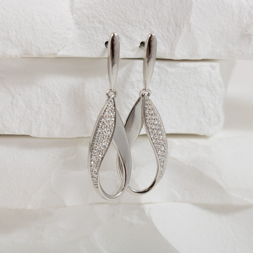 14KW Open Teardrop Diamond Earrings               

14K White Gold Open Teardrop Pave Natural Diamond Earrings

0.26 Total Natural Diamond Weight 

Earring Closure Post with Butterfly Back
