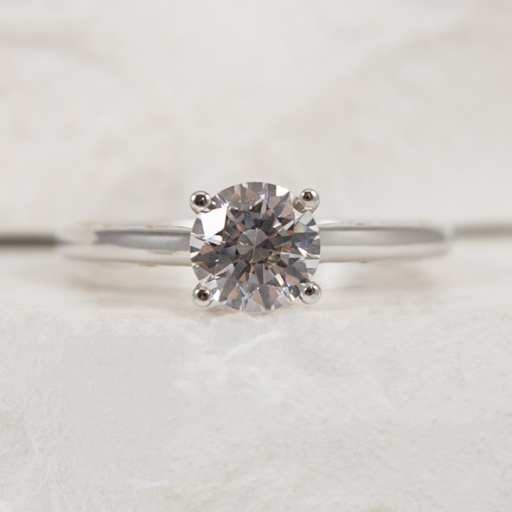 18K White Gold Diamond Ring Setting 

Center To Hold 1.00CT Round Brilliant Cut Diamond

Accent - 0.01 Total Natural Diamond Weight SI1 Clarity, G Colour

Finger Size 6.5

*Price for ring only. This ring can be set with your choice of Natural