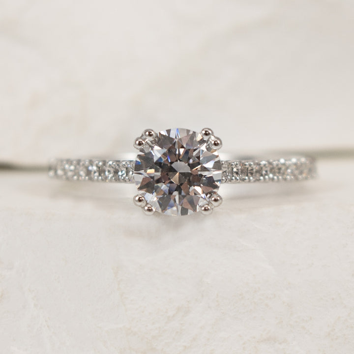 18K White Gold Diamond Accented Ring Setting

Center - To Hold 1.00CT Round Brilliant Cut Diamond

Accent - 0.33 Total Natural Diamond Weight of SI1 Clarity, G Colour

Finger Size 6.5 

*Price for ring only. This ring can be set with your cho