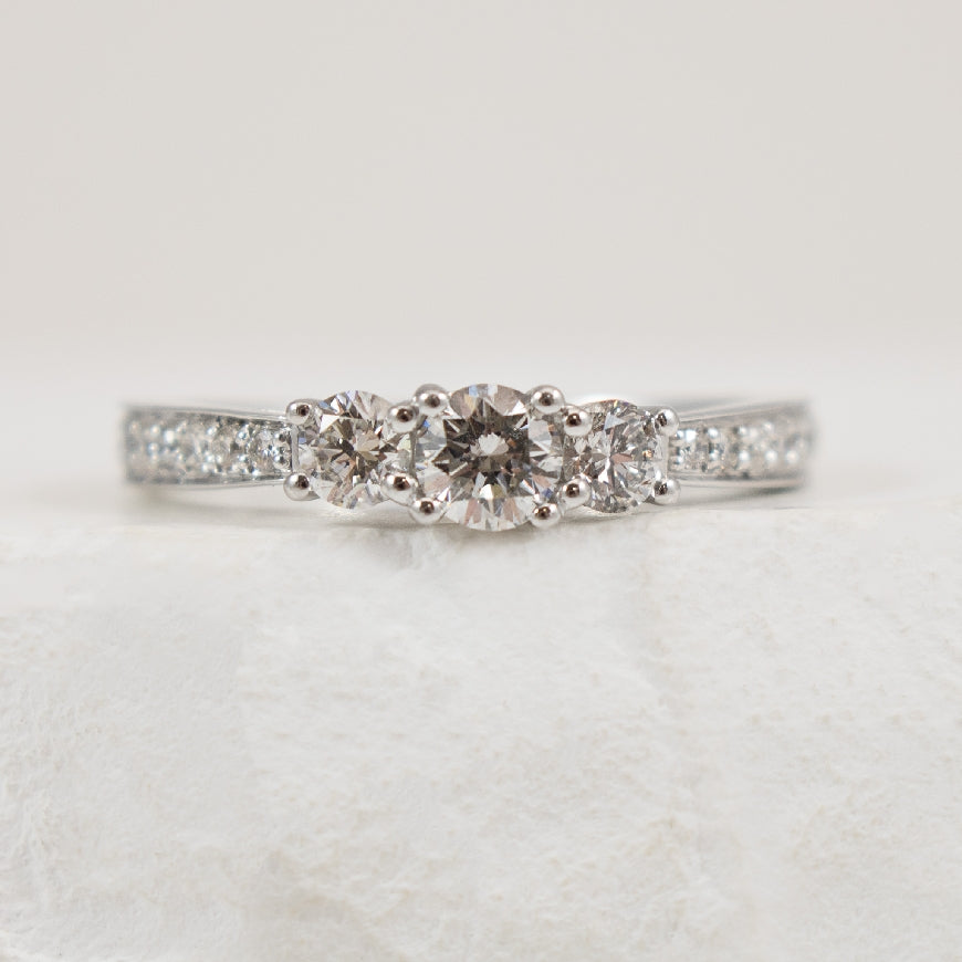 14K White Gold Canadian Diamond Three Stone Ring

0.27 Carat of Round Brilliant Cut Canadian Diamond of I1 Clarity, H Colour

0.75 Total Natural Diamond Weight 

Band Width 2mm

Finger Size 6.5 
