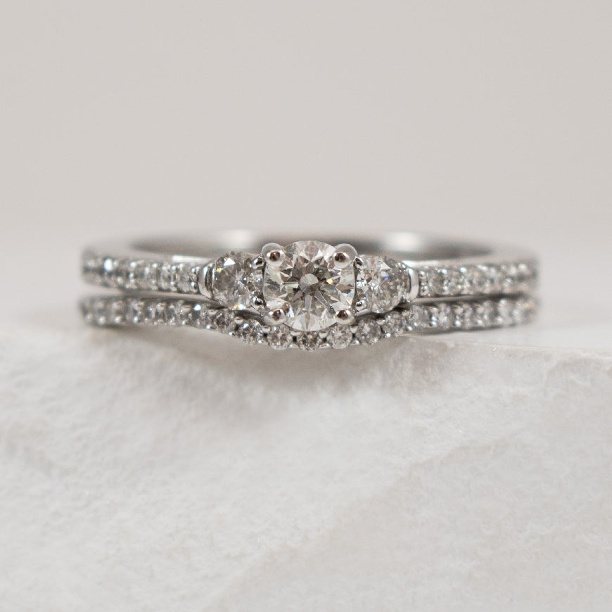 14K White Gold Natural Diamond Accented Matching Ring Set 

0.25 Carat of Round Brilliant Cut Diamond of I2 Clarity, HI Colour

0.625 Total Natural Diamond Weight 

Finger Size 6.75