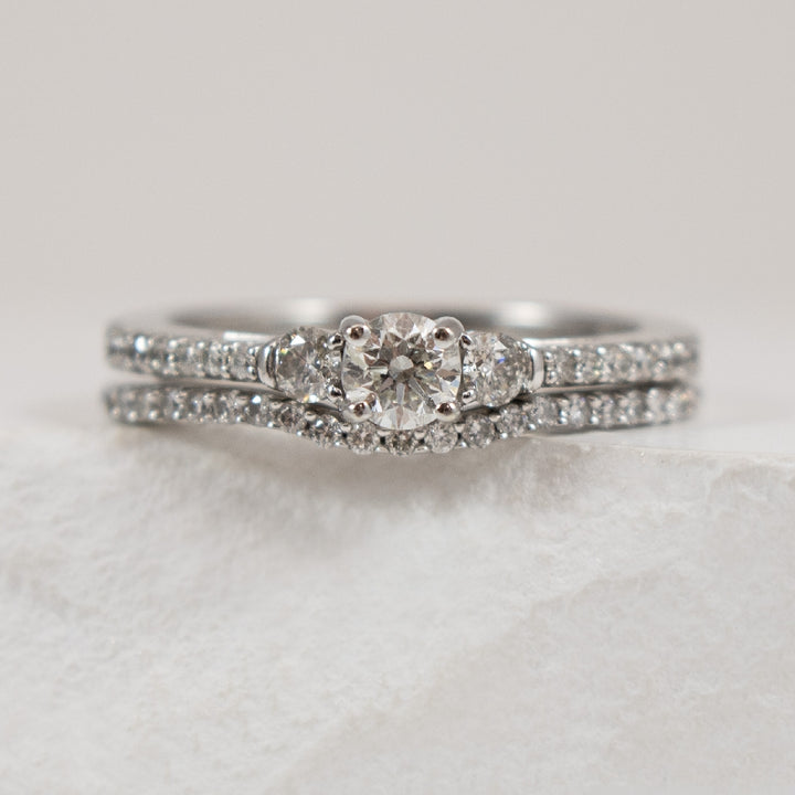 14K White Gold Natural Diamond Accented Matching Ring Set 

0.25 Carat of Round Brilliant Cut Diamond of I2 Clarity, HI Colour

0.625 Total Natural Diamond Weight 

Finger Size 6.75