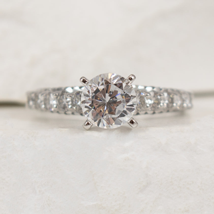 14K White Gold Diamond Accented Ring Setting

Center - To Hold 1.00CT Round Brilliant Cut Diamond

Accent - 0.94 Total Natural Diamond Weigh of I1 Clarity, GH Colour

Finger Size 6.5

*Price for ring only. This ring can be set with your choic