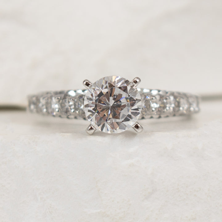 14K White Gold Diamond Accented Ring Setting

Center - To Hold 1.00CT Round Brilliant Cut Diamond

Accent - 0.94 Total Natural Diamond Weigh of I1 Clarity, GH Colour

Finger Size 6.5

*Price for ring only. This ring can be set with your choic