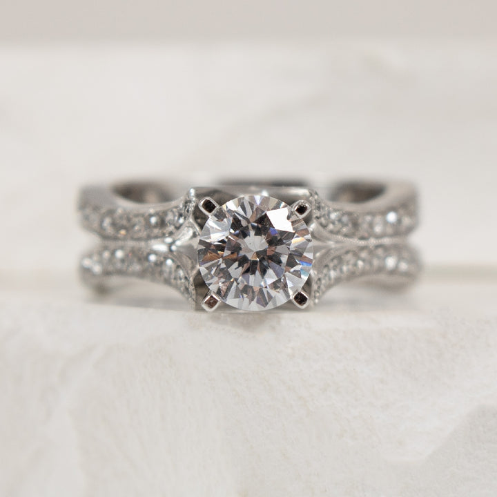 14K White Gold Diamond Accented Ring Setting

Center - To Hold 1.00CT Round Brilliant Cut Diamond 

Accent - 0.51 Total Natural Diamond Weight of I1 Clarity, GH Colour

Finger Size 6.5 

*Price for ring only. This ring can be set with your ch