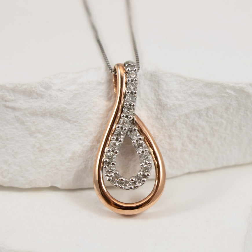 10K White & Rose Gold Natural Diamond Necklace 

0.25 Total Natural Diamond Weight of I1 Clarity, GH Colour

