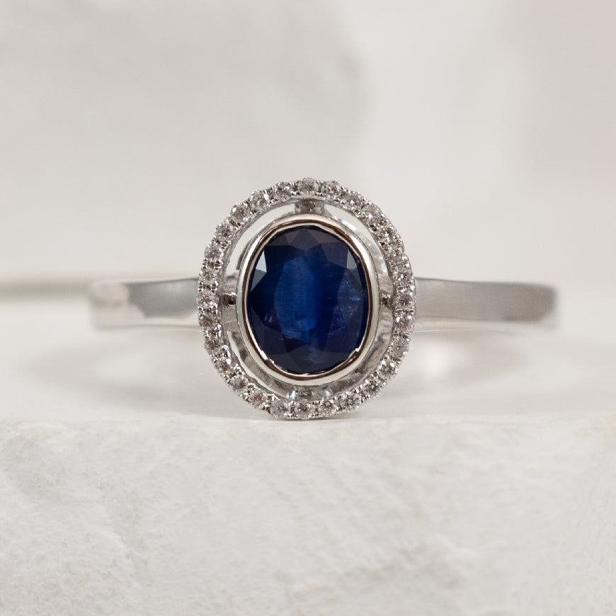 14K White Gold Sapphire & Natural Diamond Ring 

0.08 Total Natural Diamond Weight

0.88 Carat of Sapphire 

Finger Size 

