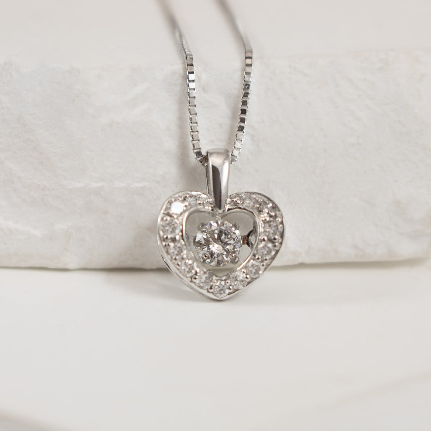 10K White Gold Natural Diamond Heart Pulse Necklace 

0.25 Total Natural Diamond Weight I2-3 Clarity, IJK Colour

