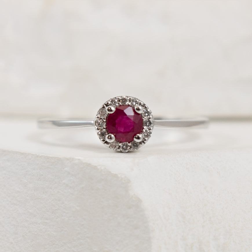 10K White Gold Ruby & Diamond Halo Ring 

0.06 Total Natural Diamond Weight 

Finger Size 6.25
