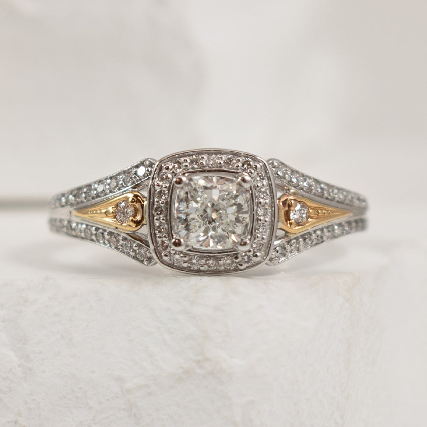 18K White & Rose Gold & Palladium Canadian Diamond Accented Halo Ring

Center - 0.50 Cushion Cut Natural Canadian Diamond of I1 Clarity, H Colour, VG Cut

Accent - 0.20 Total Natural Diamond Weight 
0.70TDW

Band Width 2.3mm

Finger Size 6.5