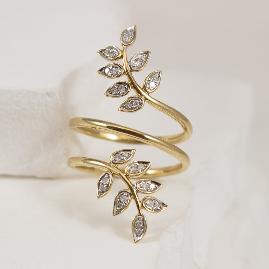 10K Yellow Gold Natural Diamond Wrapped Leaf Ring 

0.13 Total Natural Diamond Weight 

Finger Size 6 
