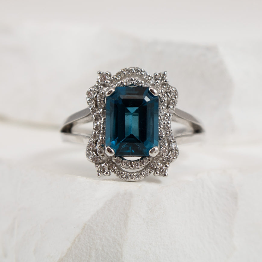 14KW Large Blue Topaz & Diamond Halo Ring         

14K White Gold Large Blue Topaz & Diamond Halo Ring 

0.27 Total Natural Diamond Weight of I2 Clarity, H-J Colour

Finger Size 7 

